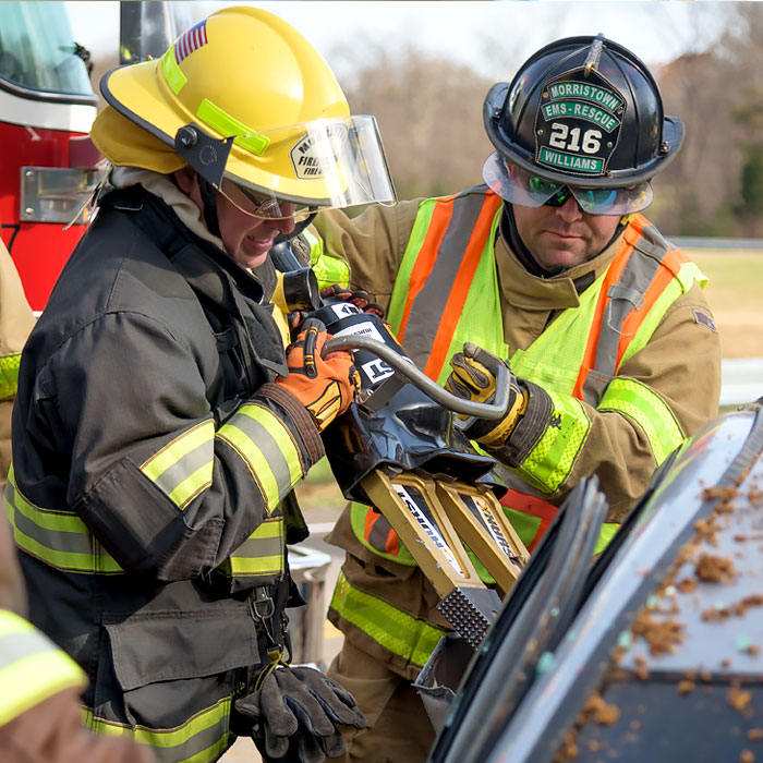 Two people working with emergency equipment
