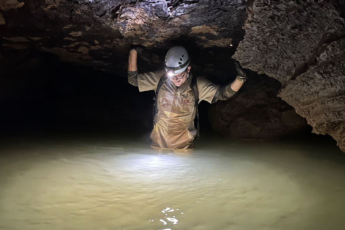 A person exploring a cave.