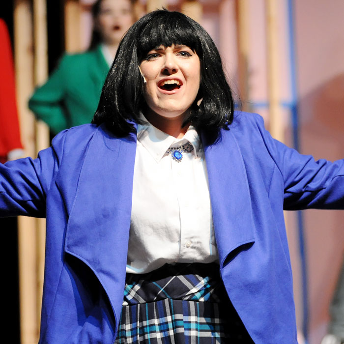 A student performing on stage.