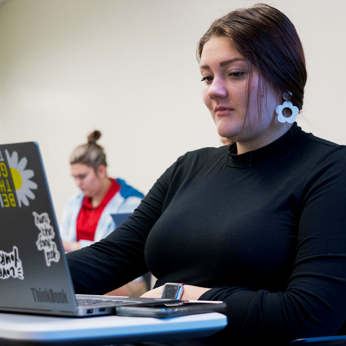 A student sitting at a desk