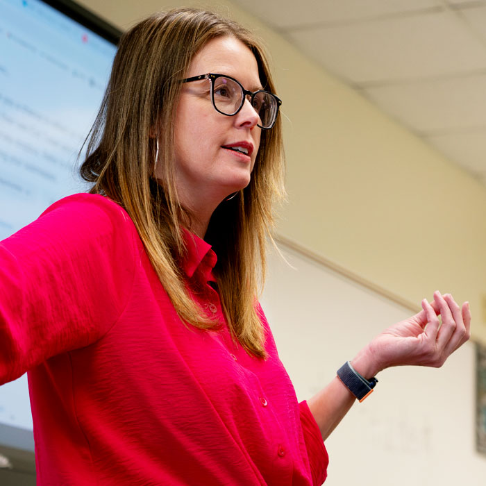 A professor speaking to a class.