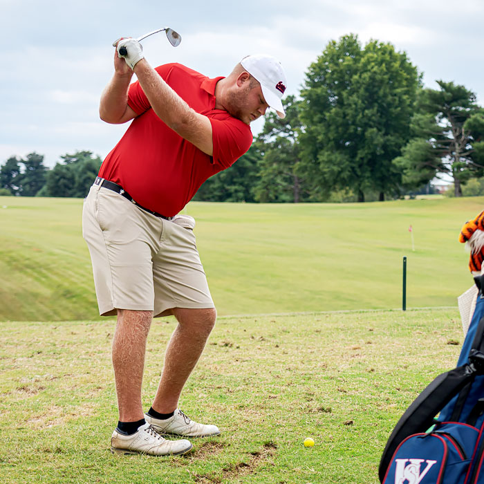 A golfer swinging a club