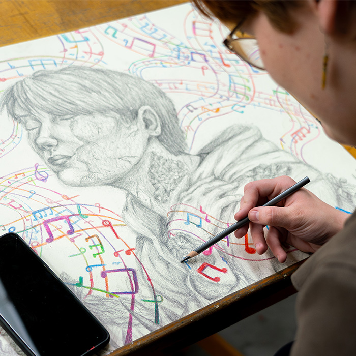 A student working on a drawing.