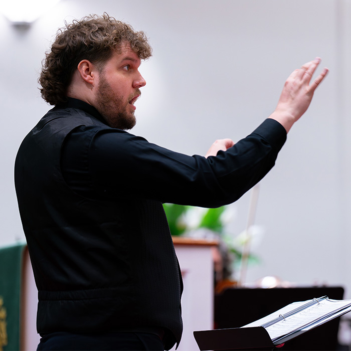 A person conducting music