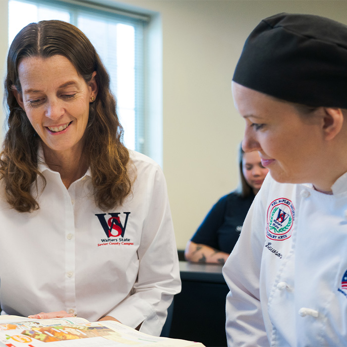 A student and instructor working together