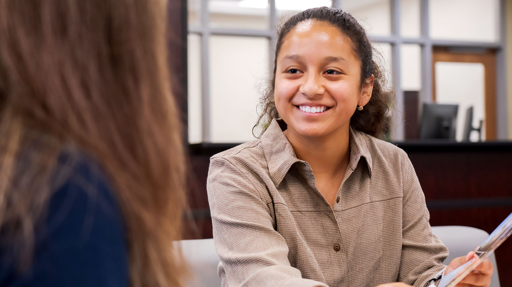 A Senators Central Navigator assisting a student.