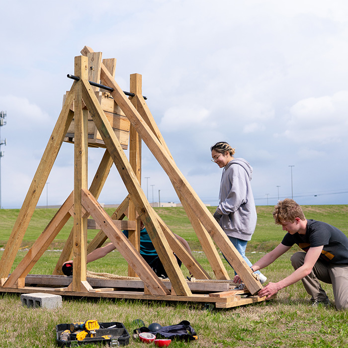 Students assembling a trebuchet