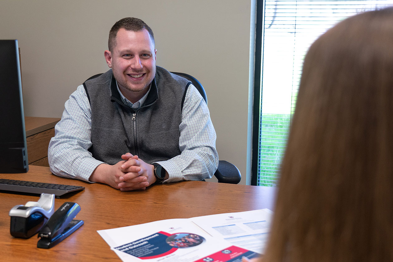 An academic advisor working with a student